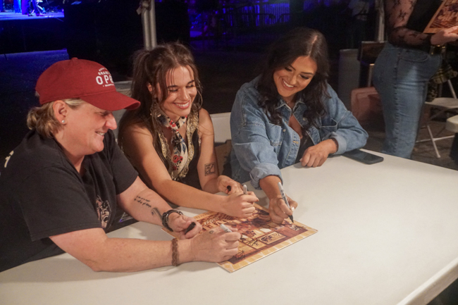 Sister Sadie signing merch at the 2025 Bluegrass & Chili Festival in Oklahoma - photo © Pamm Tucker